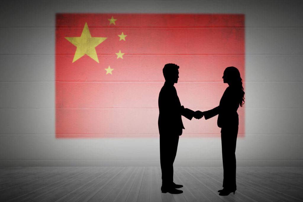 composite image silhouette business people shaking hands
