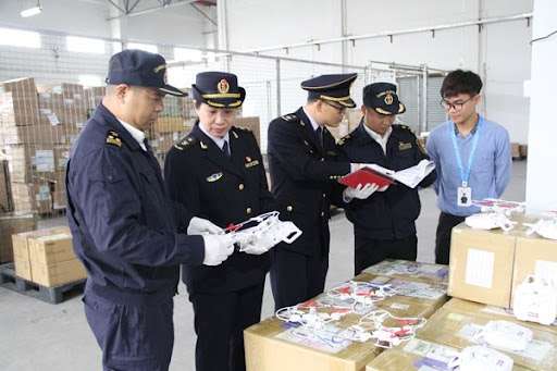 Customs officers inspecting goods at a Chinese port